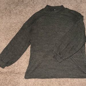 Green mock neck sweater.